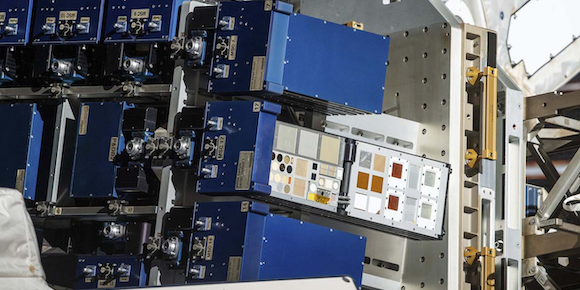 The Materials International Space Station Experiment (MISSE) Flight Facility on the exterior of the space station exposes L3Harris’ materials to the harsh environment of space (Courtesy NASA)