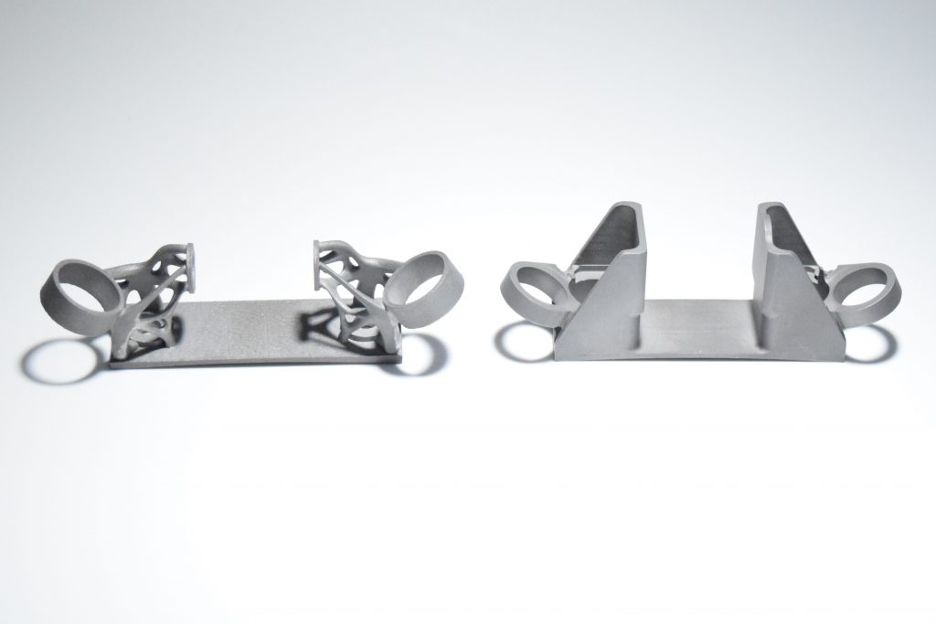AM-designed bracket (left) and traditionally manufactured (right) which were compared in AMGTA’s paper (Courtesy Business Wire)