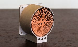Fig. 2 Multi-material heat sink additively manufactured in a copper alloy (inner core) and stainless steel (outer shell) (Courtesy Fraunhofer IAPT)