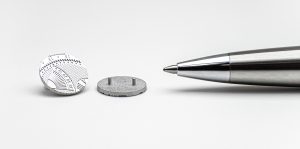 Fig. 5 Stainless steel cufflinks produced by LMM and shown in the as-sintered stated prior to surface polishing (Courtesy Incus)