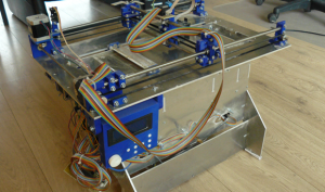 The Plan B is an open source Binder Jetting machine, printing in powder with a custom binder. It is constructed from common 3D printer parts and of the shelf inkjet technology. It offers a resolution of 96 DPI (roughly 0.26 mm per dot) and costs around €1000 to make (Courtesy Ytec3D)