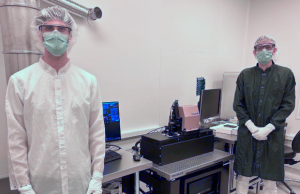 Nikolas Roeske, Process Equipment Engineer at Georgia Tech, and Riccardo Conte, Exaddon R&D Engineer, standing next to the CERES system (Courtesy Exaddon)