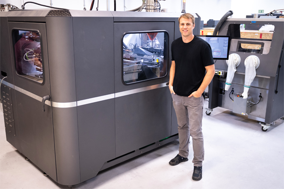 FreeFORM Technologies President Nate Higgins in front of a Desktop Metal X25Pro (Courtesy Desktop Metal)