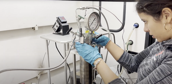 A member of the winning team of NASA’s 2023’s BIG Idea Challenge working on their Lunar Forge project, Production of Steel from Lunar Regolith through Carbonyl Iron Refining (Courtesy NASA)