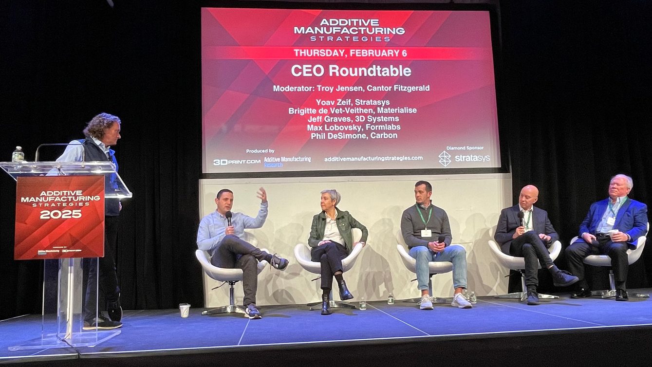 Fig. 6 The CEO Roundtable at AMS 2025: Left to right: Troy Jensen (Cantor Fitzgerald), Maxim Lobovsky (Formlabs), Brigitte de Vet-Veithen (Materialise) Philip DeSimone (Carbon), Yoav Zeif (Stratasys), and Jeffrey Graves, 3D Systems (Courtesy AMS 2025)