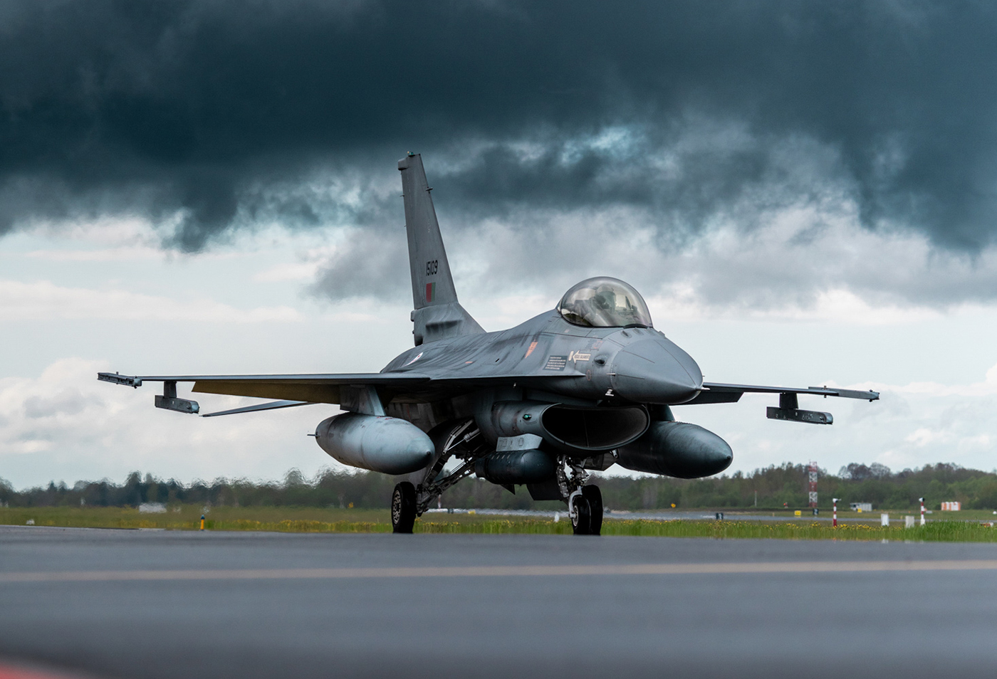 Fig. 1 A Portuguese Air Force fighter pilot taxis for take-off in an F-16 Fighting Falcon during a Baltic Air Policing Rotation in Estonia (Courtesy NATO)