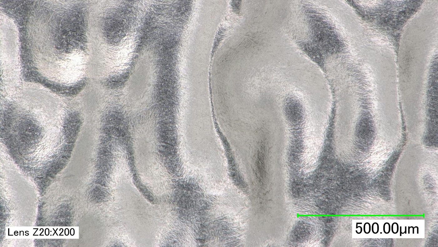 Fig. 5 Example of PBF-EB/Ti-6Al-4V micrograph showing high levels of residual waviness (Courtesy REM Surface Engineering)