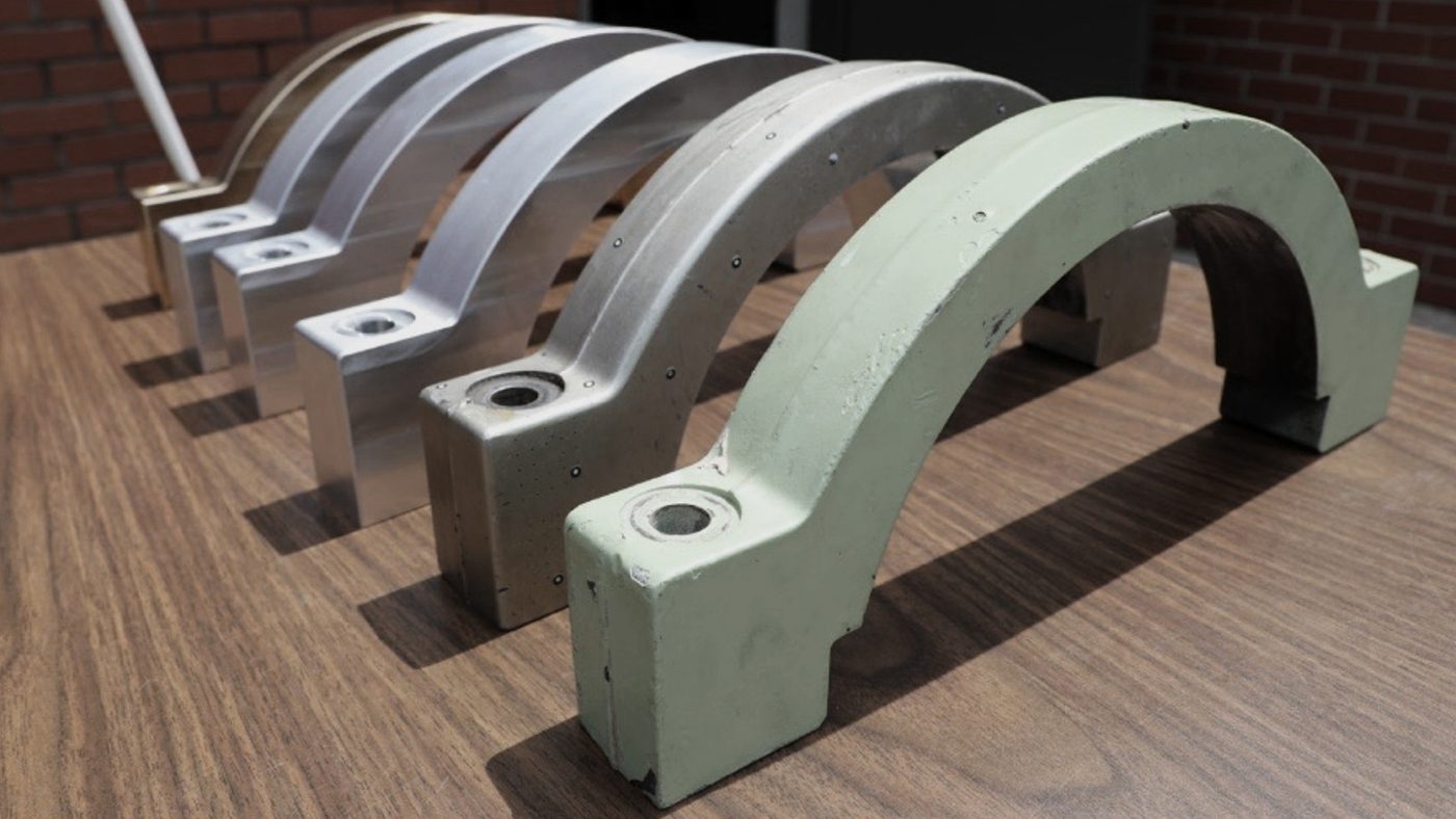 Fig. 5 A Bradley Fighting Vehicle’s transmission mount (before and after) manufactured using SPEE3D technology by US soldier with no prior Additive Manufacturing experience during U.S. Army Combat Capabilities Development Command (DEVCOM) Army Research Laboratory (ARL) advanced manufacturing demonstration at the University of Tennessee Knoxville (Courtesy SPEE3D)