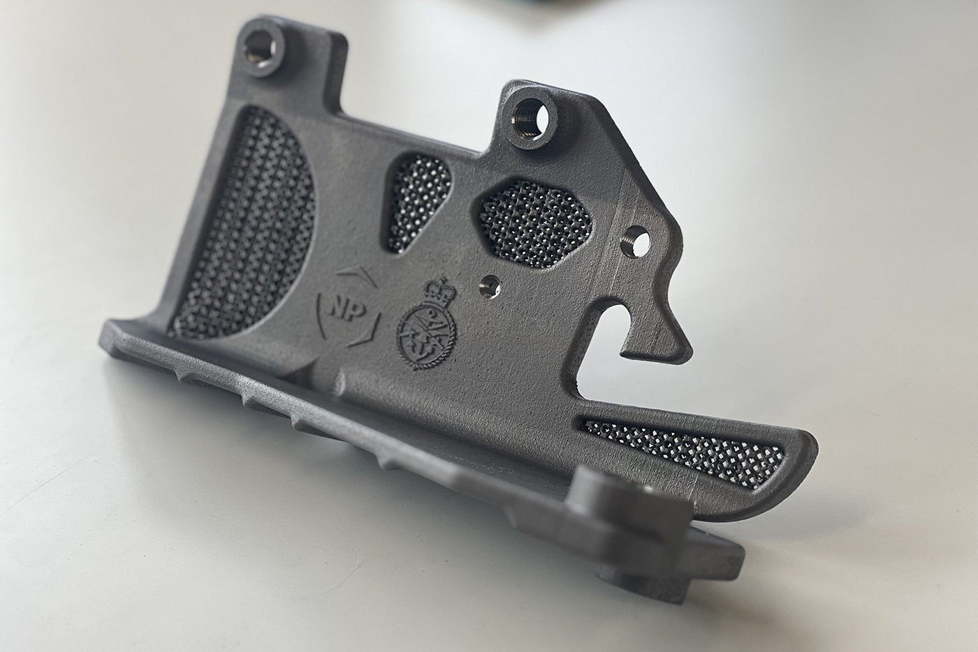 Fig. 6 The UK’s Digital Manufacturing Centre (DMC) is working in partnership with NP Aerospace to deliver state-of-the-art metal engineering solutions as part of the UK Ministry of Defence’s Project TAMPA. This Mastiff/Ridgeback patrol vehicle door latch was manufactured using Laser Beam Powder Bed Fusion (PBF-LB) Additive Manufacturing technology at the DMC (Courtesy DMC)