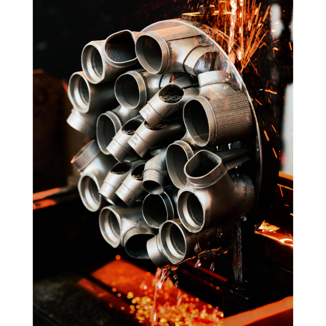 Fig. 5 Steelnovo frame nodes produced by Laser Beam Powder Bed Fusion (PBF-LB) being separated from the build plate by wire EDM (Courtesy Colnago)