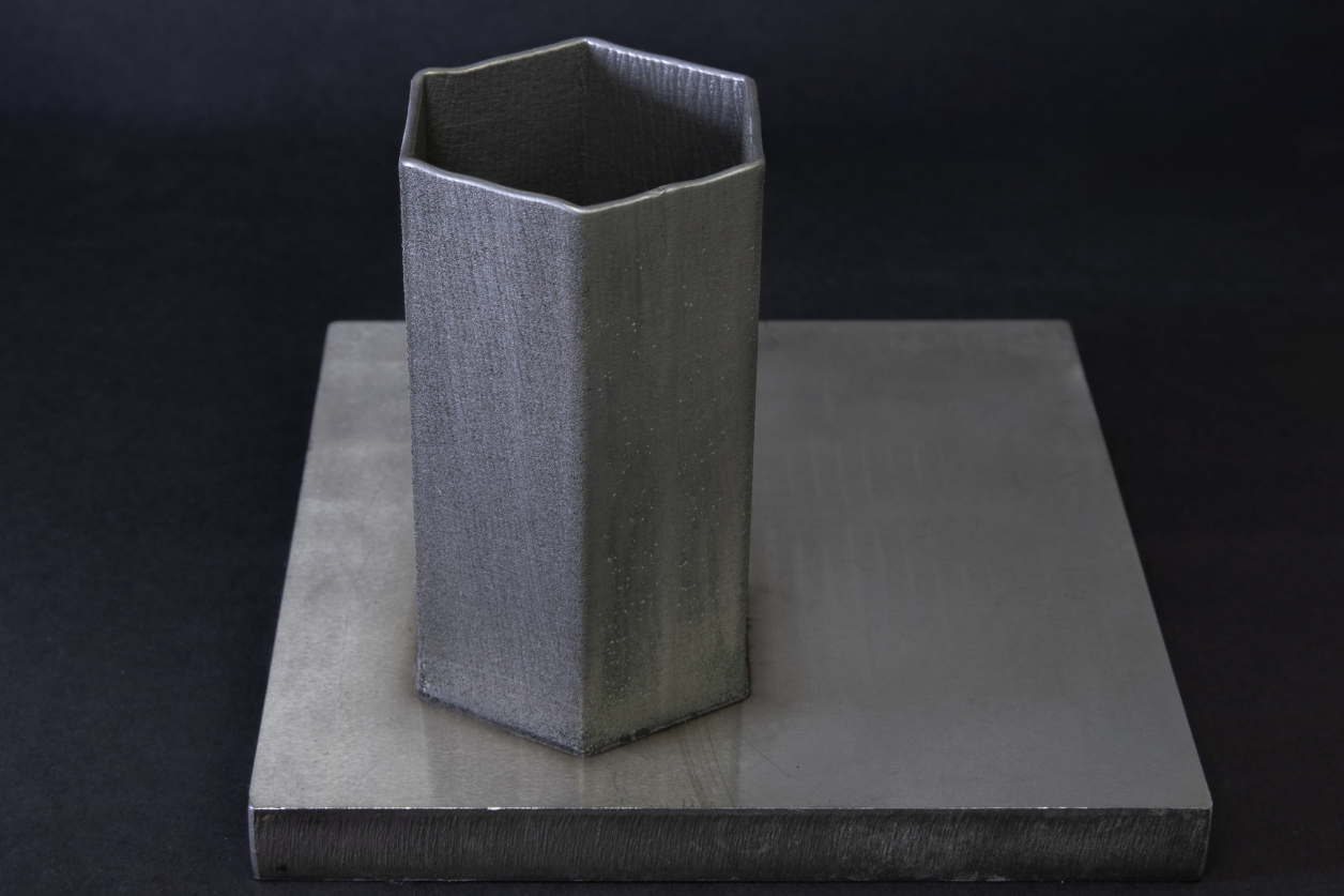 Fig. 7 Hexagonal component fabricated using a continuous, uninterrupted deposition process, based on the single-track strategy developed for the IG13 nozzle (480 layers, 140 x 40 mm)