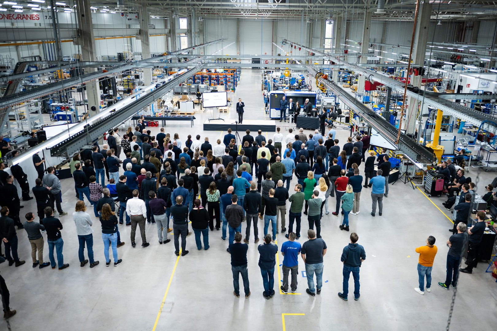 Fig. 7 View inside the production hall at Nikon SLM Solutions in Lübeck during a visit by Nikon Corporation President Muneaki Tokunari (Courtesy of Nikon)