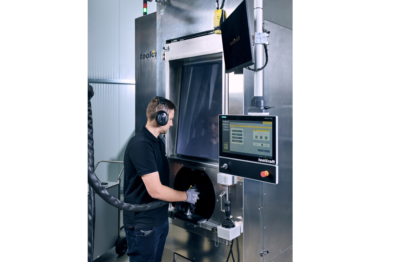 Fig. 7 An operator using the SupportBlaster machine (Courtesy toolcraft)