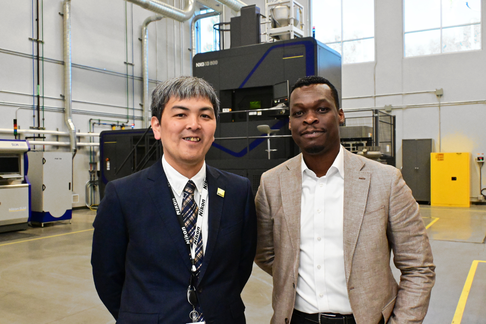 Fig. 9 Koki Takeshita (left), Assistant Director, Nikon Advanced Manufacturing (DED solutions), and Nneji Kemakolam (right), VP of Engineering and Products, Nikon SLM Solutions (ultra-large platforms) (Courtesy Nikon)