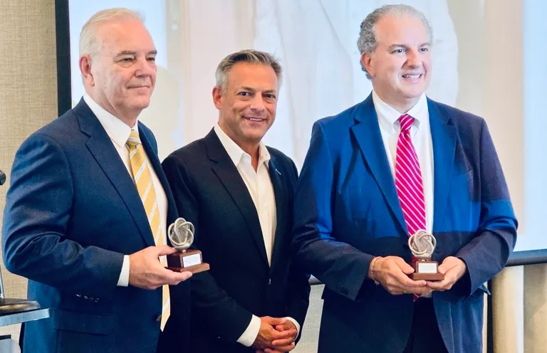 Neal Orringer, President of ASTRO America (centre), presents metal AM trophies to Rep Jimmy Patronis (R-Fla, right) and Charles W Rigdon, Chair of Triumph Gulf Coast (left), in recognition of their contributions to Northwest Florida’s aerospace and defence industry (Courtesy ASTRO America)